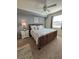 Bright bedroom with a king-size bed and ensuite bathroom at 17118 Vardon Ter # 305, Bradenton, FL 34211
