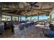 Outdoor bar and lounge area with pool views at 17118 Vardon Ter # 305, Bradenton, FL 34211
