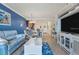 Spacious living area with comfortable seating and a large TV at 17118 Vardon Ter # 305, Bradenton, FL 34211