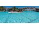 Stunning resort-style pool with waterfalls and lounge chairs at 17118 Vardon Ter # 305, Bradenton, FL 34211