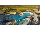Large resort-style pool with waterfall feature at 17118 Vardon Ter # 305, Bradenton, FL 34211