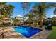 Inviting pool area with patio furniture and tiki bar at 1898 Wharf Rd, Sarasota, FL 34231