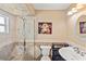 Bathroom with glass shower, stone tile, and modern vanity at 2115 Cambridge Dr, Sarasota, FL 34232