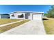 Newly renovated single-story home with a spacious yard and attached garage at 22220 Lasalle Rd, Port Charlotte, FL 33952