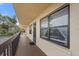 Private balcony with access from condo unit and view of parking lot at 305 30Th W Ave # A208, Bradenton, FL 34205