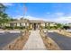 Community clubhouse with landscaping and flag at 305 30Th W Ave # A208, Bradenton, FL 34205