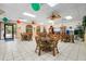 Community room with tables, chairs, and TV at 305 30Th W Ave # A208, Bradenton, FL 34205