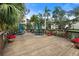 Outdoor deck featuring plenty of seating with tables and a view of the property at 305 30Th W Ave # A208, Bradenton, FL 34205