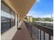 Exterior hallway with access to condo units and parking at 305 30Th W Ave # A208, Bradenton, FL 34205