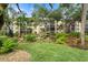 Lush landscaping and a stone fountain create a tranquil courtyard at 305 30Th W Ave # A208, Bradenton, FL 34205
