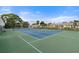 Community tennis court with green surface and blue lines at 305 30Th W Ave # A208, Bradenton, FL 34205