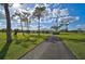 Single-story home with circular driveway and landscaping at 3120 Lena Ln, Sarasota, FL 34240