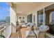 Relaxing balcony with outdoor furniture and water view at 35 Watergate Dr # 801, Sarasota, FL 34236
