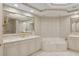 Luxurious bathroom with soaking tub and double vanity at 35 Watergate Dr # 801, Sarasota, FL 34236