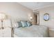 Bright bedroom with plush bedding and elegant decor at 35 Watergate Dr # 801, Sarasota, FL 34236