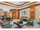 Luxurious community room with comfortable seating and a fireplace at 35 Watergate Dr # 801, Sarasota, FL 34236