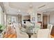 Bright dining room with hardwood floors and kitchen access at 35 Watergate Dr # 801, Sarasota, FL 34236