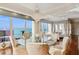 Elegant dining room with chandelier and water views at 35 Watergate Dr # 801, Sarasota, FL 34236