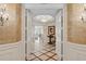 Elegant entryway with marble floors and detailed millwork at 35 Watergate Dr # 801, Sarasota, FL 34236