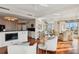 Modern kitchen with white cabinets, granite counters, and stainless steel appliances at 35 Watergate Dr # 801, Sarasota, FL 34236