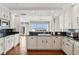 Spacious kitchen featuring granite countertops and custom cabinetry at 35 Watergate Dr # 801, Sarasota, FL 34236