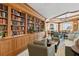 Community library with extensive book collection and comfortable seating at 35 Watergate Dr # 801, Sarasota, FL 34236