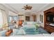 Bright living room featuring hardwood floors, comfy seating and a large window at 35 Watergate Dr # 801, Sarasota, FL 34236
