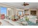 Sunlit living room with water views and comfortable seating at 35 Watergate Dr # 801, Sarasota, FL 34236