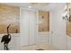 Elegant lobby with elevator and mosaic wall at 35 Watergate Dr # 801, Sarasota, FL 34236