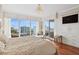 Bright and airy main bedroom with stunning water views and a chaise lounge at 35 Watergate Dr # 801, Sarasota, FL 34236