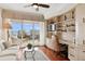 Home office with built-in shelving and hardwood floors at 35 Watergate Dr # 801, Sarasota, FL 34236