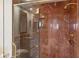 Large shower with marble tile and glass enclosure at 35 Watergate Dr # 801, Sarasota, FL 34236