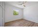 Bedroom with hardwood floor and window with exterior view at 3791 Surrey Ln, Sarasota, FL 34235