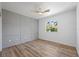 Bright bedroom with grey accent wall and hardwood floors at 3791 Surrey Ln, Sarasota, FL 34235