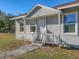 Front view of a gray house with white door at 3904 35Th E Ave, Palmetto, FL 34221