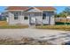 Gray house with white trim and a gravel driveway at 3904 35Th E Ave, Palmetto, FL 34221