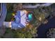 Stunning aerial view of home with pool, dock, and beautiful landscaping at 3930 Elysian Woods Ln, Sarasota, FL 34231