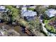 Aerial view of a home with a screened-in pool near a waterway at 3930 Elysian Woods Ln, Sarasota, FL 34231