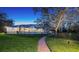 Beautiful backyard featuring a screened pool and a brick walkway leading to the home at 3930 Elysian Woods Ln, Sarasota, FL 34231