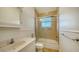 This bathroom features a shower and tub combination with a single sink and counter space at 3930 Elysian Woods Ln, Sarasota, FL 34231