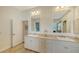 This bright bathroom features double sinks, lots of counter space and cabinetry for storage at 3930 Elysian Woods Ln, Sarasota, FL 34231
