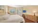 Comfortable bedroom with ample natural light and an en-suite bathroom at 3930 Elysian Woods Ln, Sarasota, FL 34231