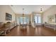 Elegant dining room with hardwood floors, decorative furnishings and large windows at 3930 Elysian Woods Ln, Sarasota, FL 34231