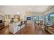 Open kitchen with granite counters, island with bar seating, and an adjacent dining area at 3930 Elysian Woods Ln, Sarasota, FL 34231