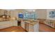 Modern kitchen with granite countertops, stainless steel appliances, and a built-in wine cooler at 3930 Elysian Woods Ln, Sarasota, FL 34231