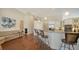 Kitchen featuring granite counters, an island with bar seating, and stainless steel appliances at 3930 Elysian Woods Ln, Sarasota, FL 34231