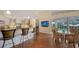 Bright kitchen with granite counters, an island with bar seating, and access to the pool area at 3930 Elysian Woods Ln, Sarasota, FL 34231