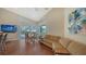 Bright living room with views of the pool and sliding glass doors to the patio at 3930 Elysian Woods Ln, Sarasota, FL 34231
