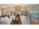 Bright living room featuring hardwood floors, stone fireplace and access to the pool deck at 3930 Elysian Woods Ln, Sarasota, FL 34231