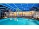 Inviting screened-in pool with adjacent patio and house, ideal for entertaining at 3930 Elysian Woods Ln, Sarasota, FL 34231